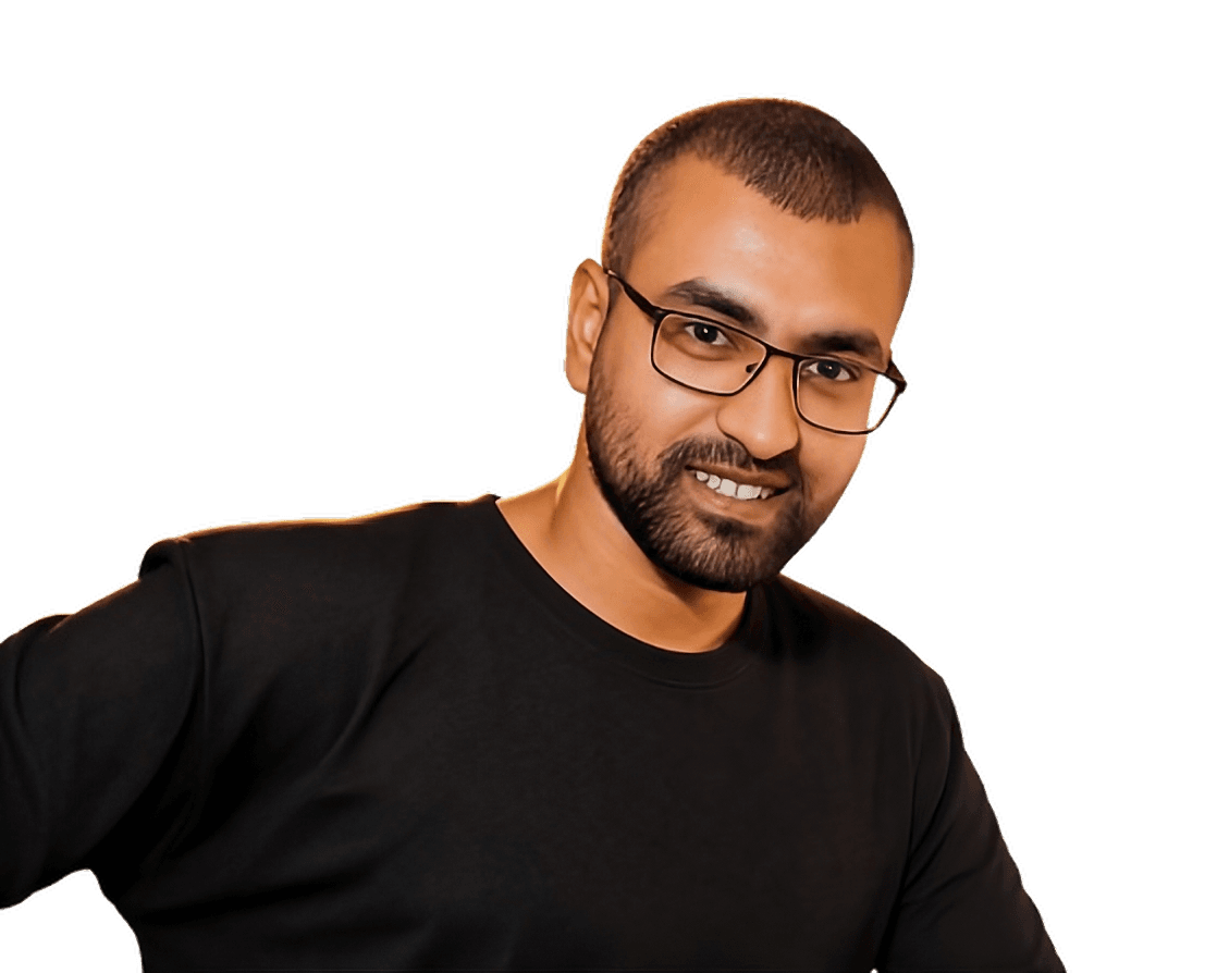 Portrait of Kerroum Nadir, smiling, wearing glasses and a dark sweater.